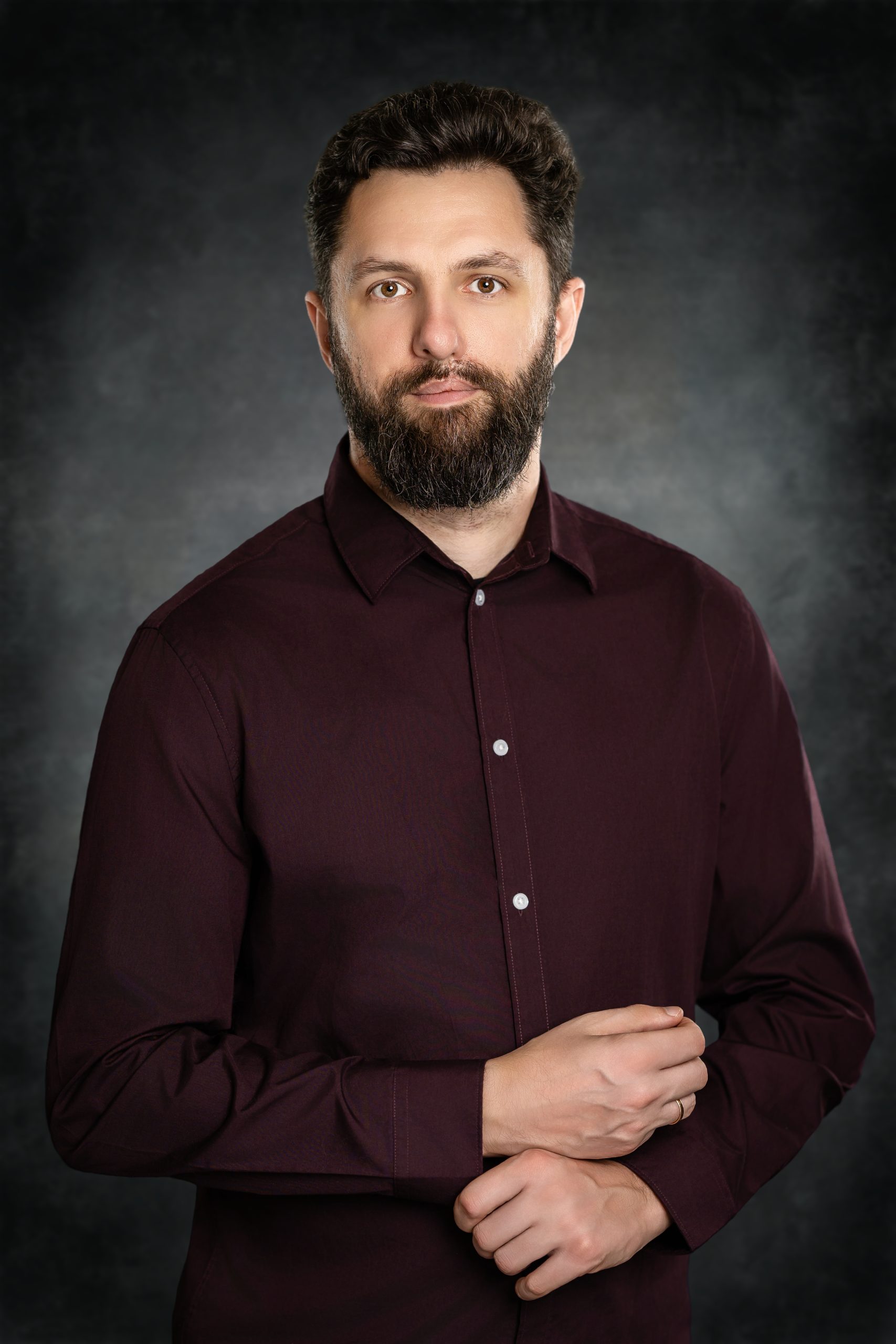 April_22_2026_20_32_03_Vlad_Mixer_Austin_Texas_Photographer Professional corporate portrait of a bearded man in a burgundy shirt perfect for company website team page