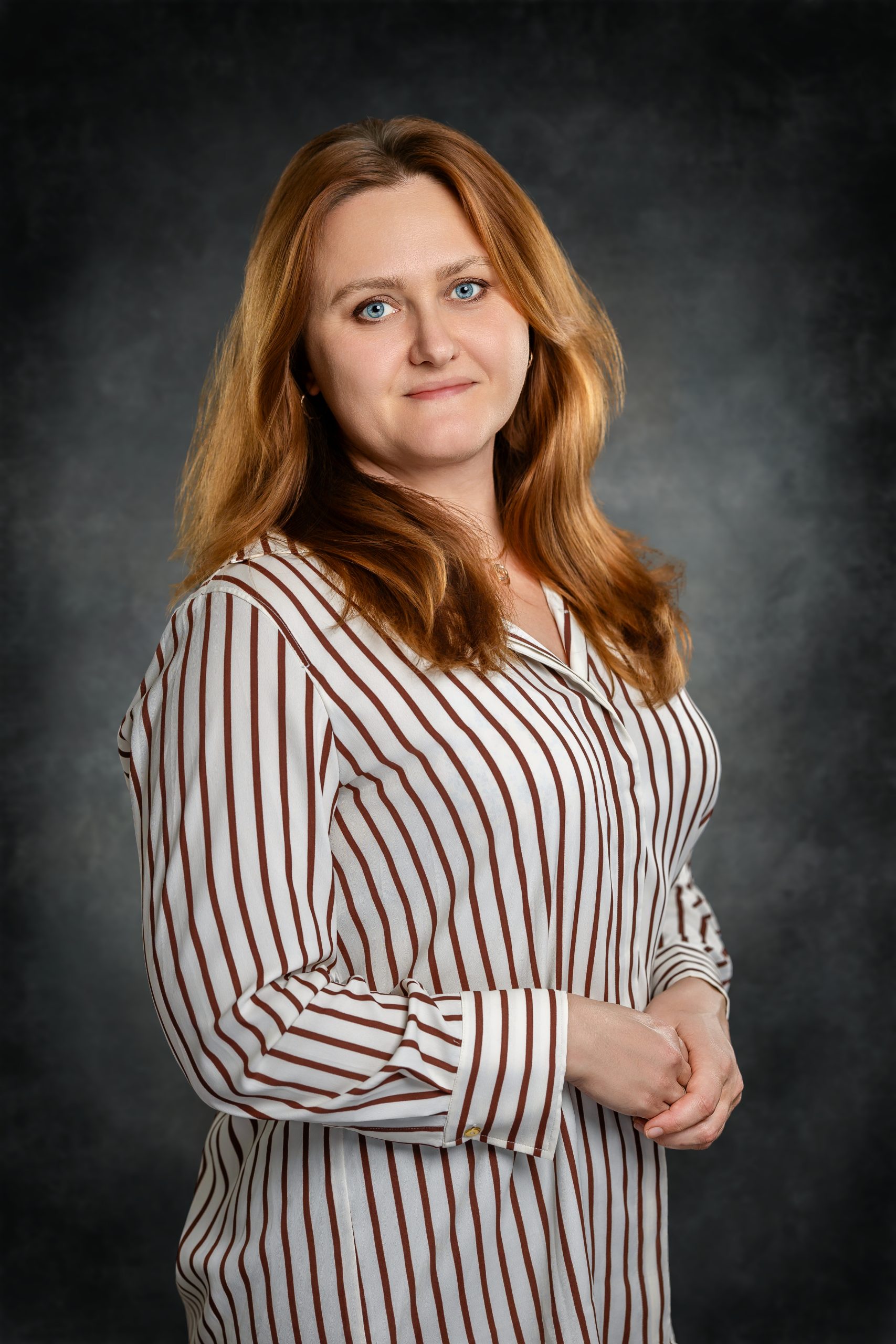 April_22_2026_21_28_47_Vlad_Mixer_Austin_Texas_Photographer Professional business headshot of a woman in a striped shirt taken by corporate photographer in Austin